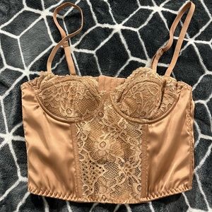 Urban Outfitters NWOT beautiful rust color corset top. Great condition.